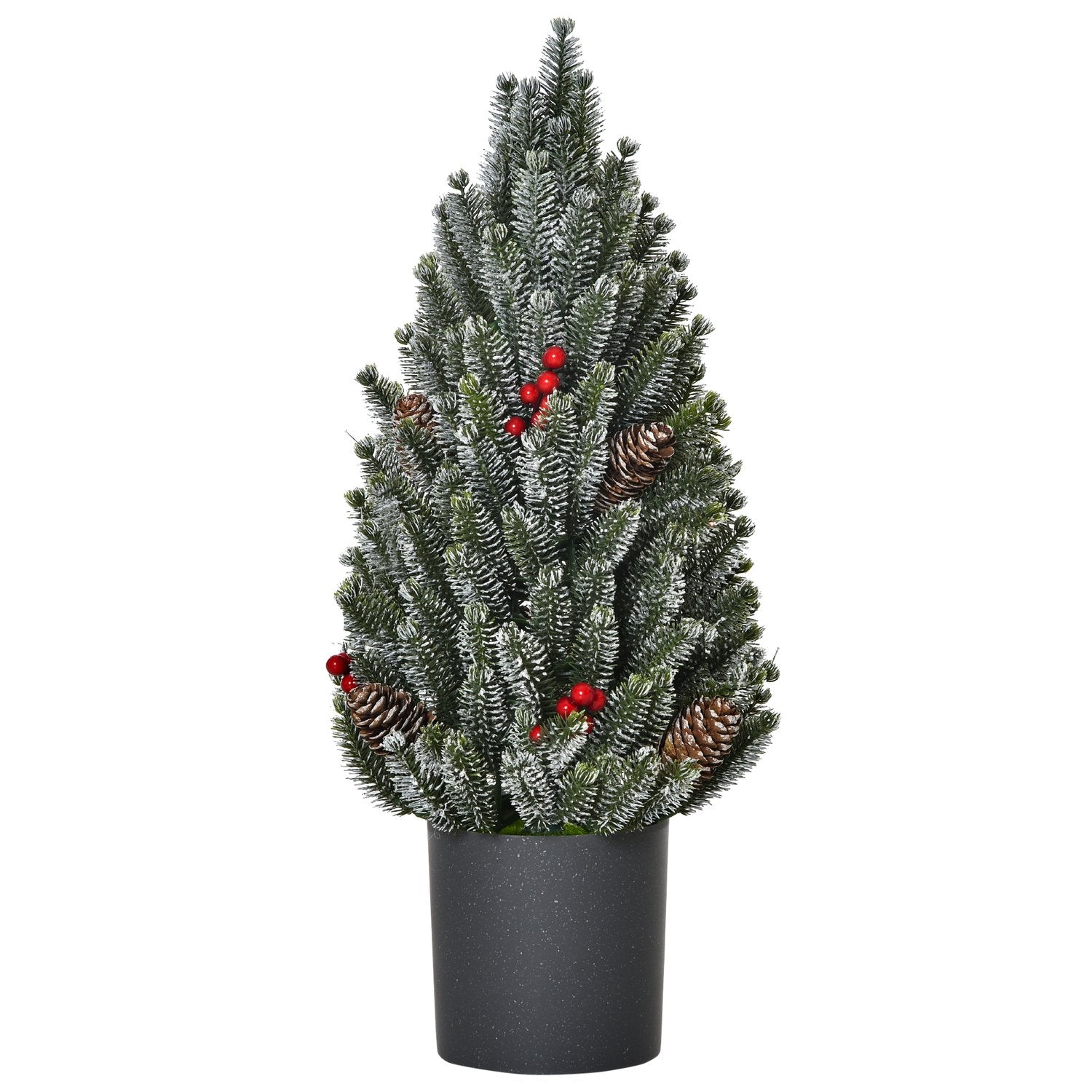 Snötäckt bordsjulgran med bär och tallkottar