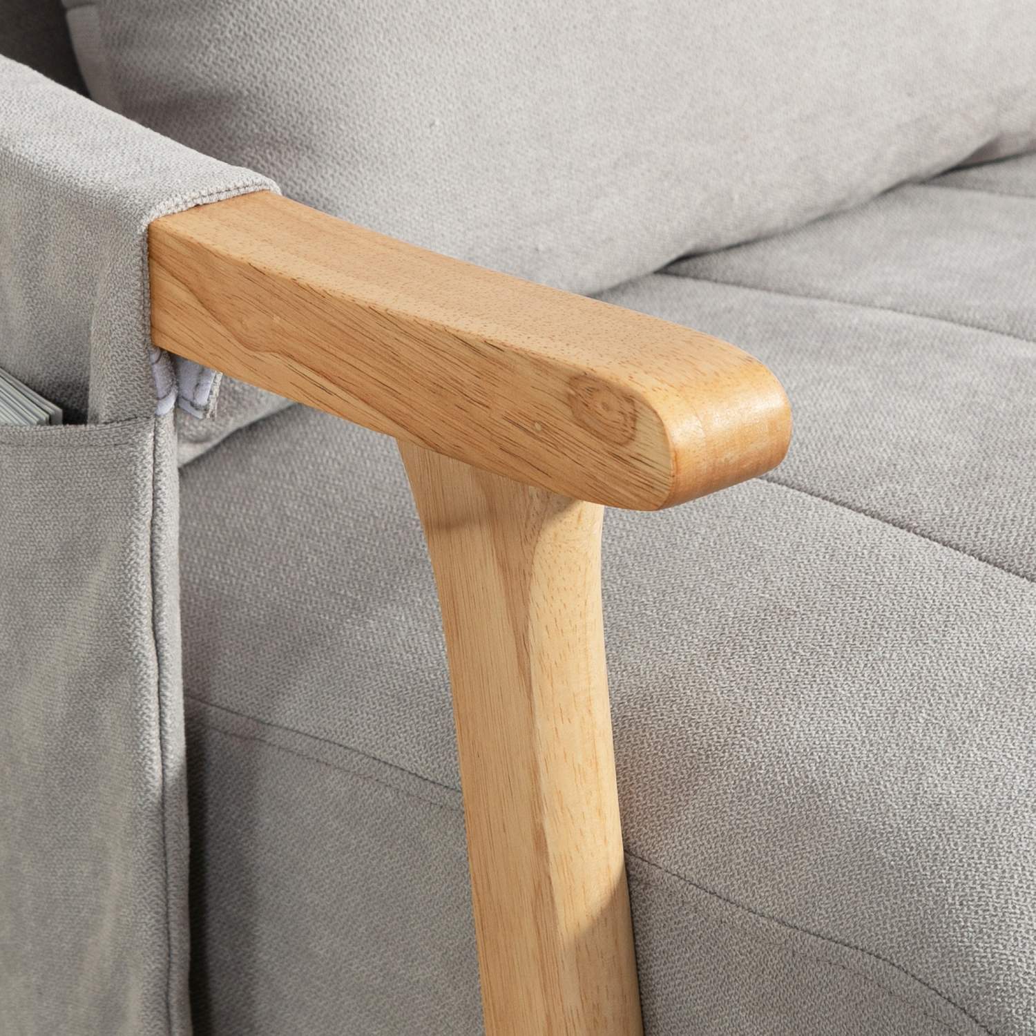 Grå vadderad gungstol med svankstöd och sidoficka