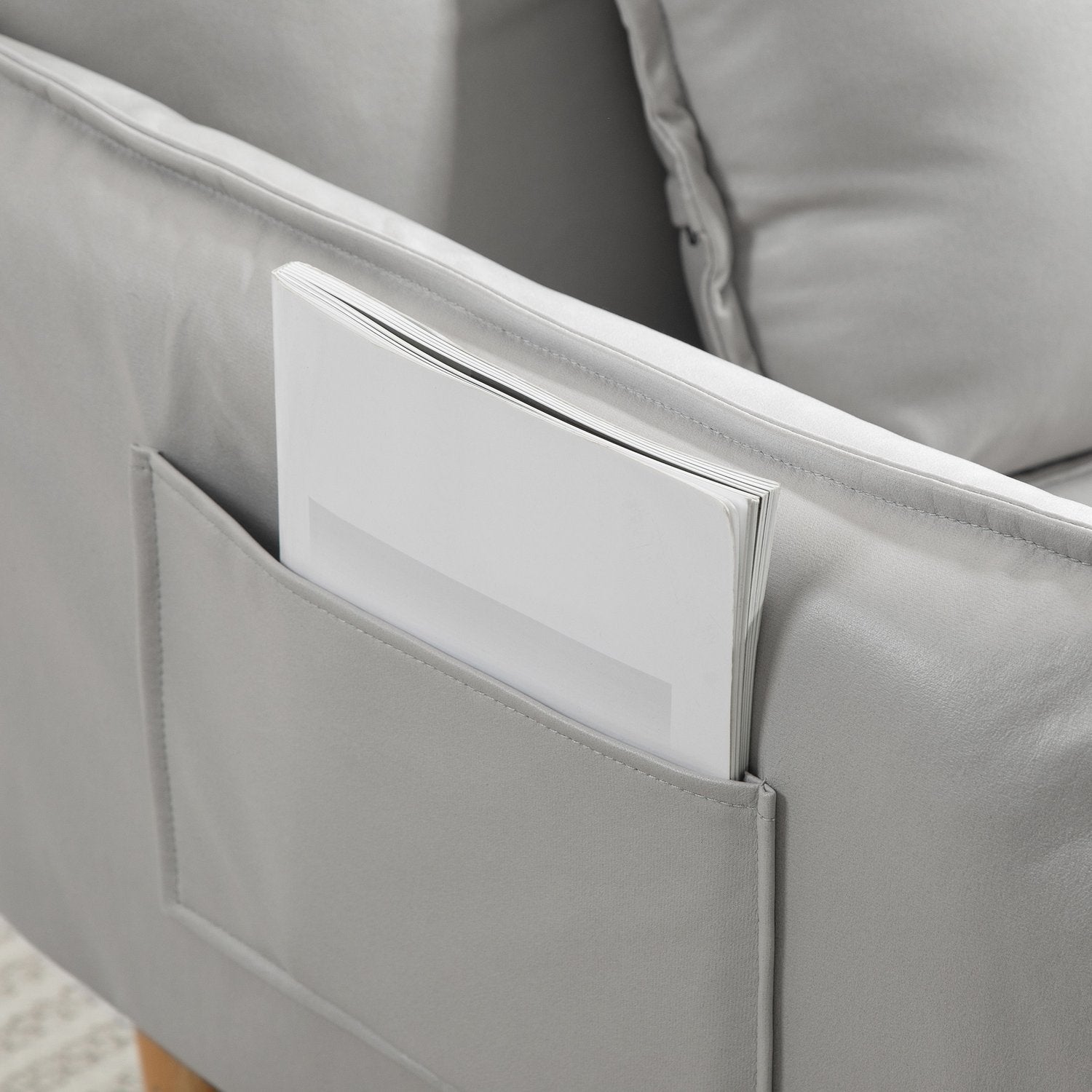 Justerbar ljusgrå stoppad fåtölj med dyna