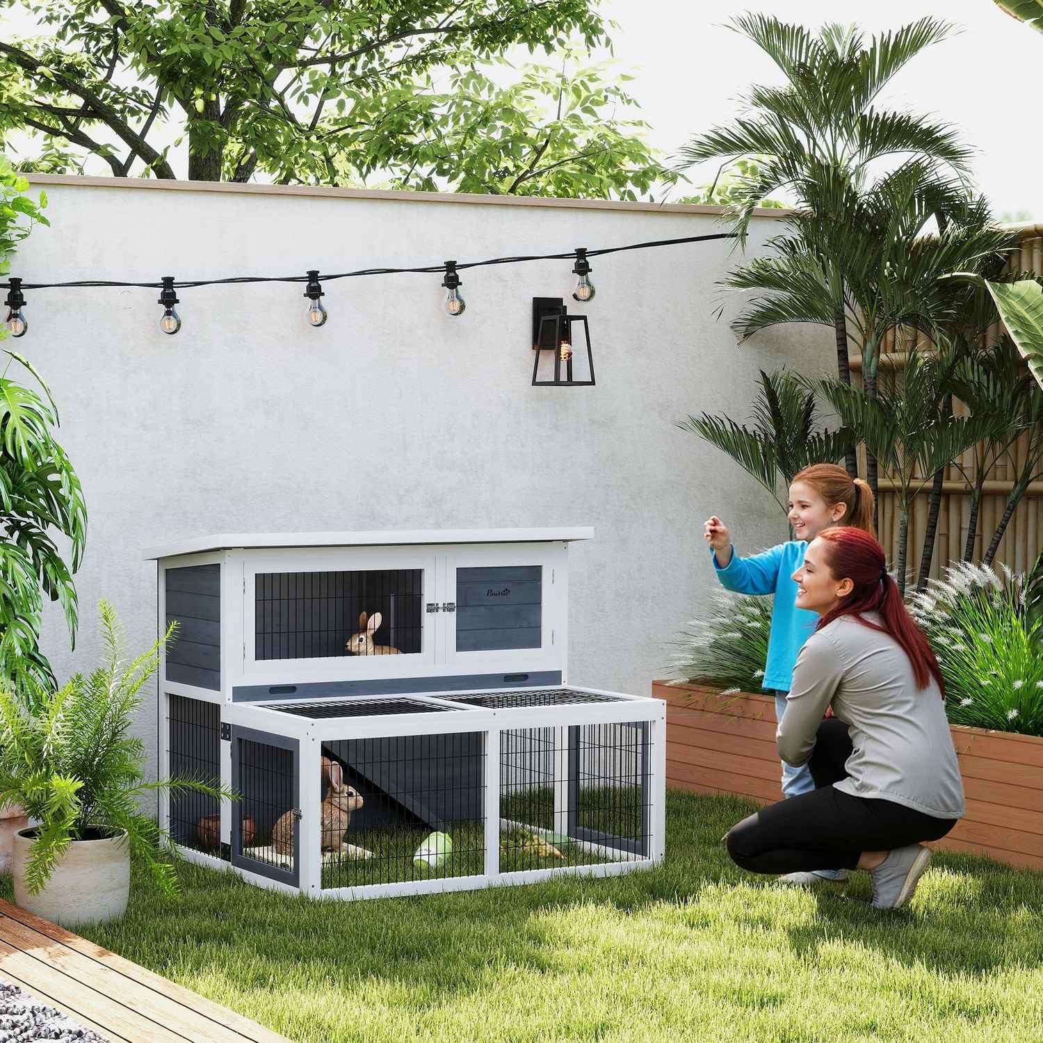 Kaninhydda i två våningar med utomhushölje