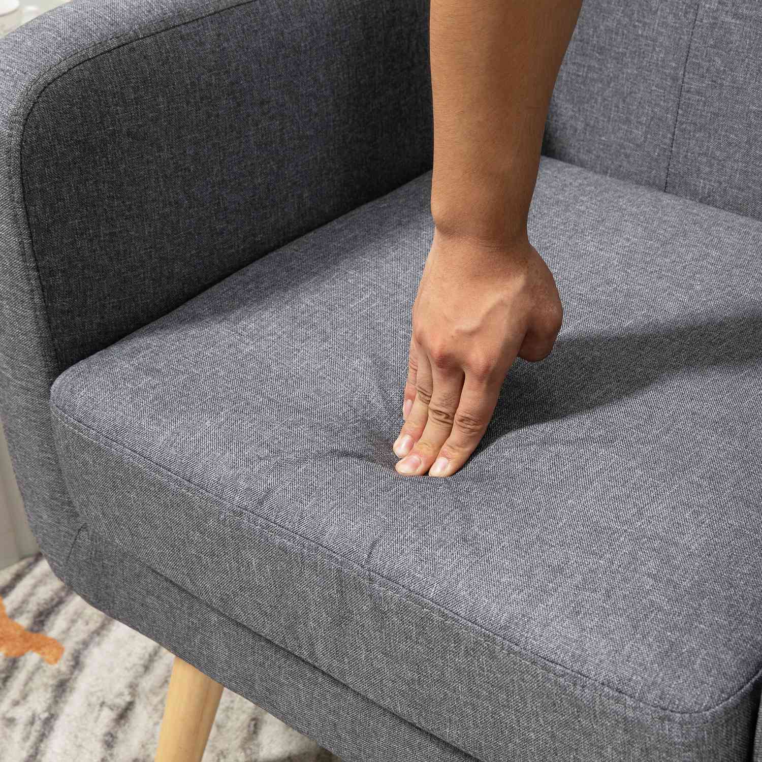 Ljusgrå stoppad avkopplingsstol för vardagsrum